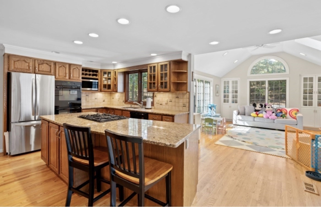 4 Kitson Park Drive Lexington, MA 02421 - Photo 9 of 38 a kitchen with stainless steel appliances granite countertop a stove and a refrigerator