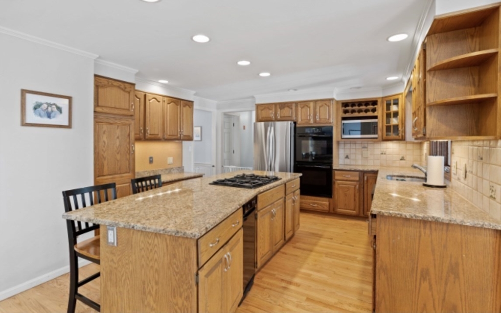 4 Kitson Park Drive Lexington, MA 02421 - Photo 10 of 38 a kitchen with a stove a refrigerator and a sink
