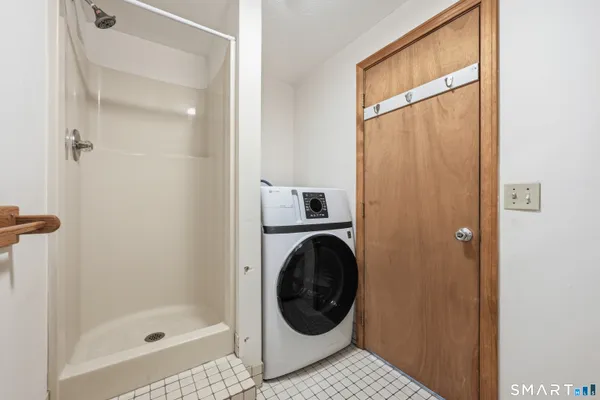 a bathroom with a bathtub and a shower