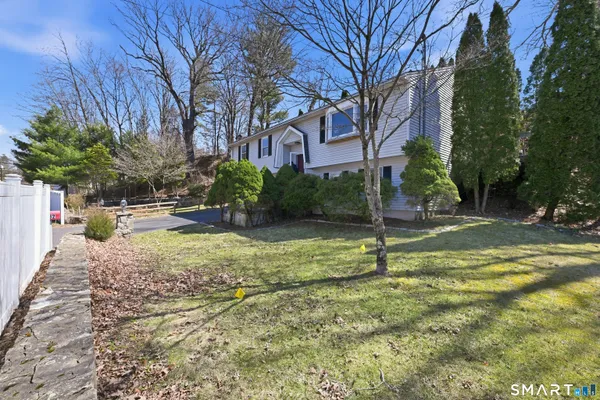 a backyard of a house with lots of green space