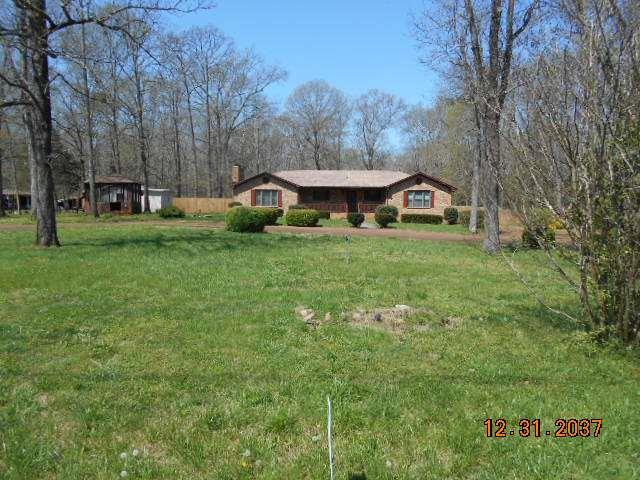 600 Murfreesboro Street Murfreesboro, TN 37127 - Photo 1 of 27 a view of a house with a big yard and large trees