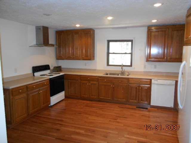 600 Murfreesboro Street Murfreesboro, TN 37127 - Photo 11 of 27 a kitchen with granite countertop a sink cabinets and stainless steel appliances