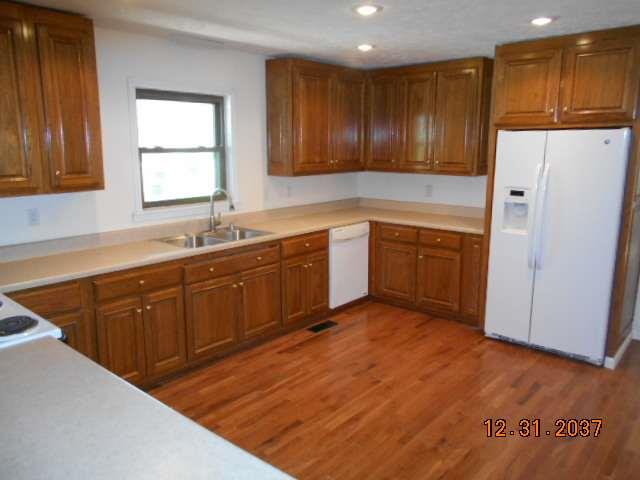 600 Murfreesboro Street Murfreesboro, TN 37127 - Photo 12 of 27 a kitchen with wooden cabinets and sink