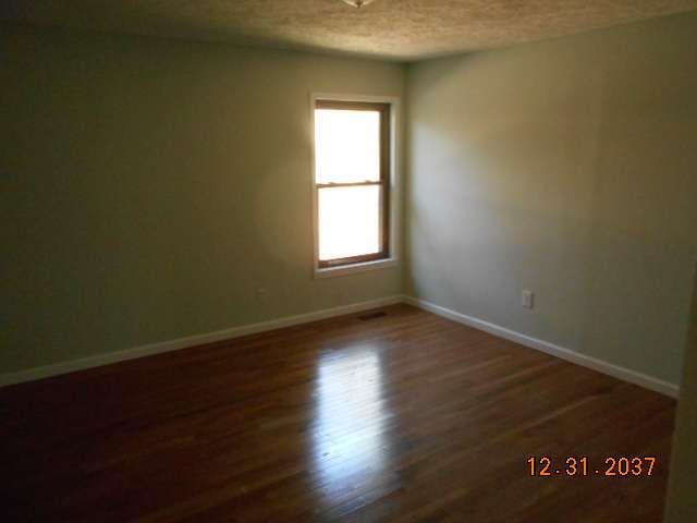 600 Murfreesboro Street Murfreesboro, TN 37127 - Photo 13 of 27 an empty room with wooden floor and windows