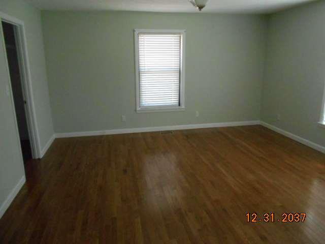 600 Murfreesboro Street Murfreesboro, TN 37127 - Photo 14 of 27 an empty room with wooden floor and windows