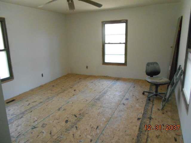 600 Murfreesboro Street Murfreesboro, TN 37127 - Photo 23 of 27 a room with exposed pipes and a window