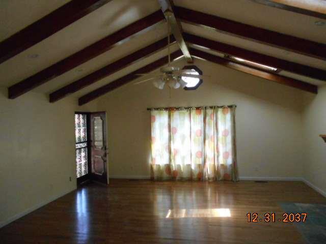 600 Murfreesboro Street Murfreesboro, TN 37127 - Photo 9 of 27 a view of an empty room with wooden floor and windows