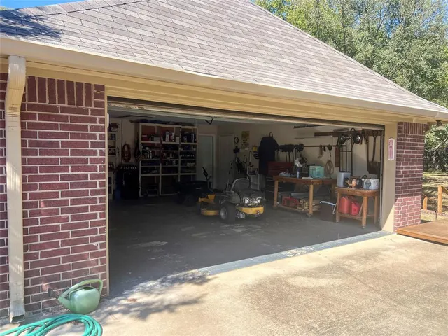 a view of a patio with table and chairs and potted plants