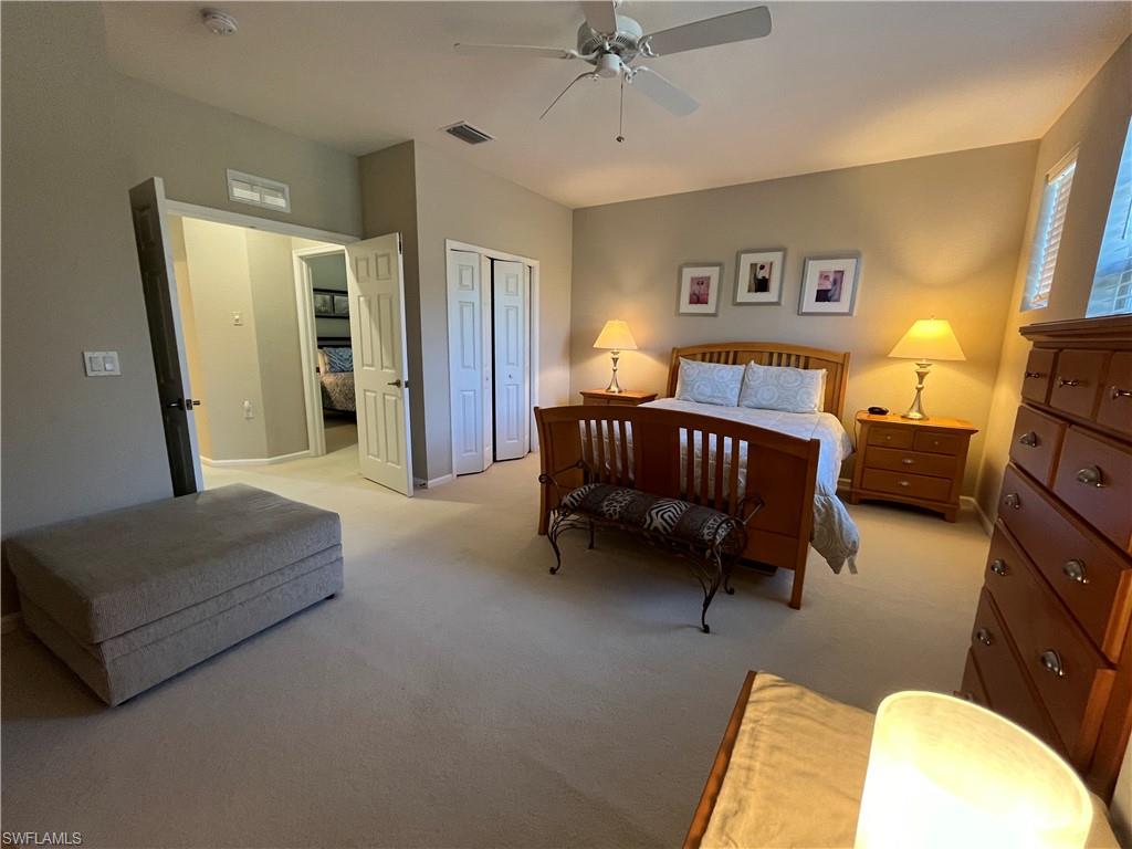 6809 Ascot Drive, Unit 202 Naples, FL 34113 - Photo 18 of 38 a living room with furniture and a baby crib