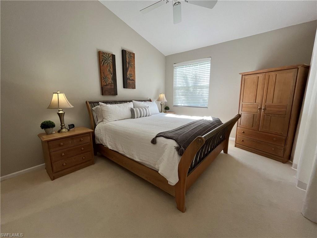 6809 Ascot Drive, Unit 202 Naples, FL 34113 - Photo 10 of 38 a bed sitting in a bedroom next to a window