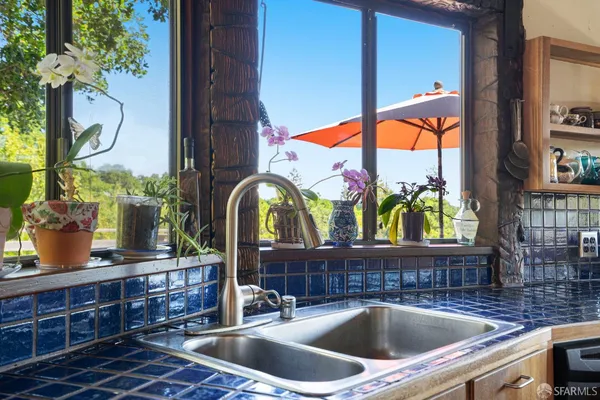 a kitchen with a sink and a window
