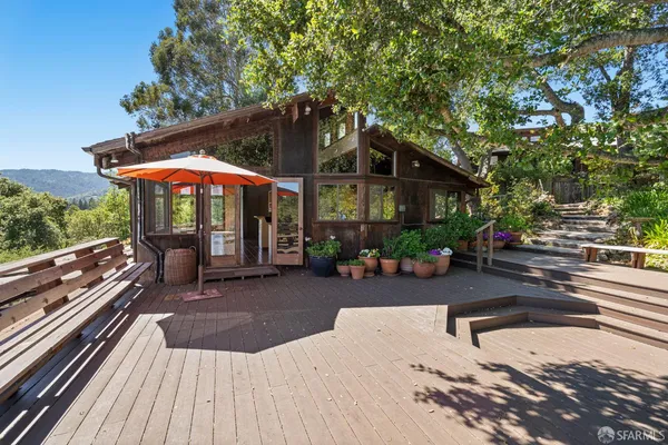 a view of a chairs and tables in the patio
