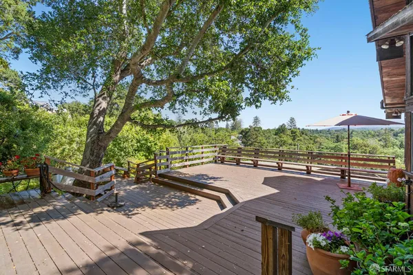 a view of a patio with table and chairs and potted plants