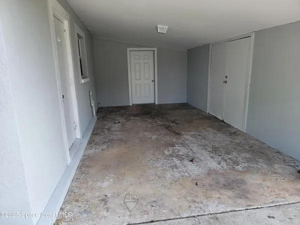 a view of an empty room and window