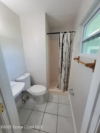 a bathroom with a toilet and a sink