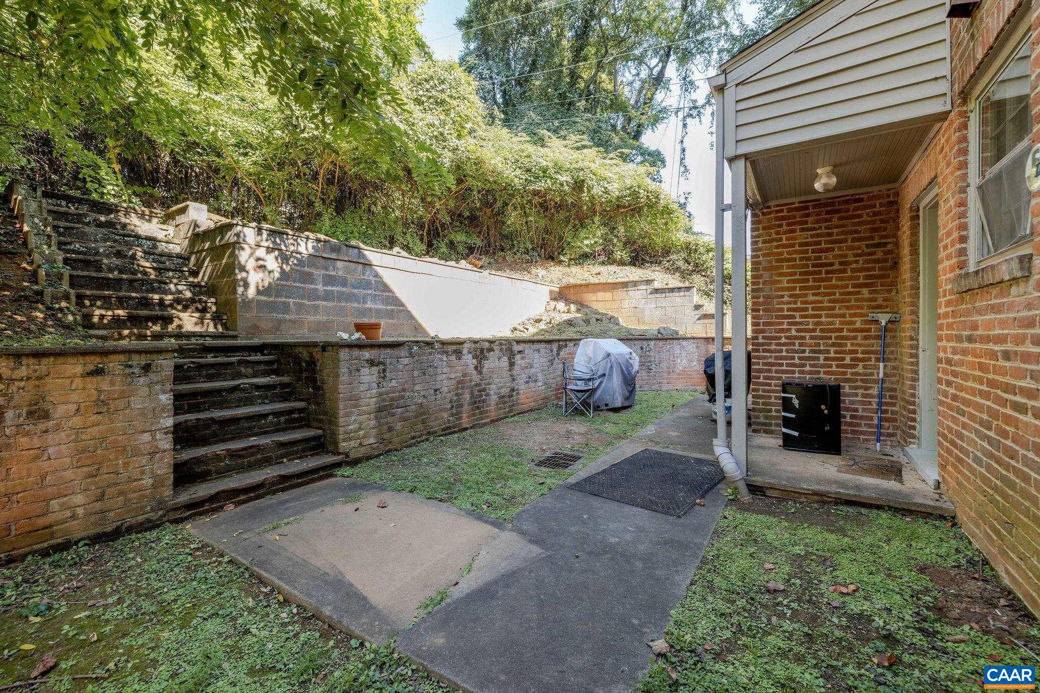 505 Valley Road Charlottesville, VA 22903 - Photo 14 of 29 a view of a backyard with door