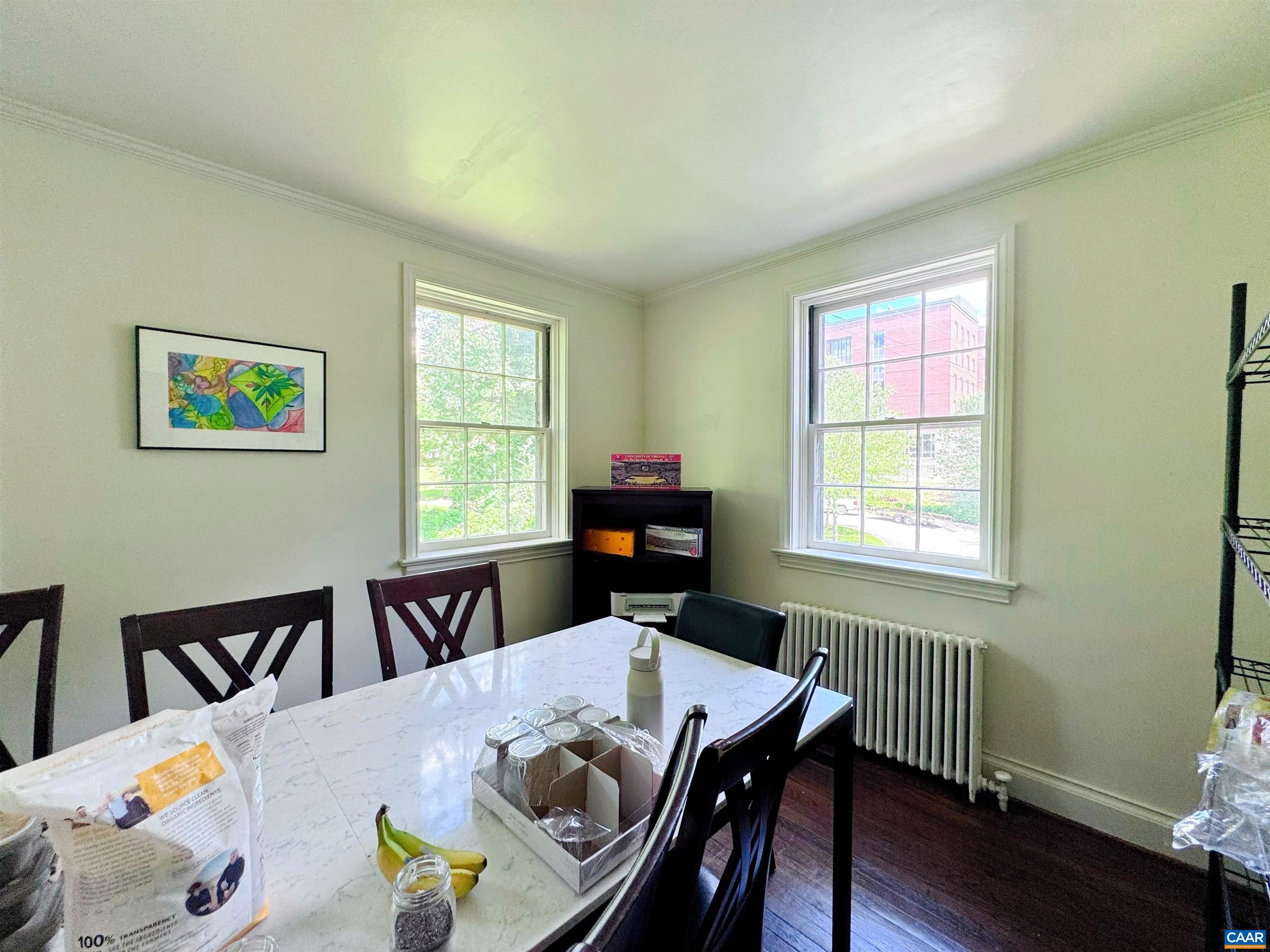 505 Valley Road Charlottesville, VA 22903 - Photo 17 of 29 a view of a dining room with furniture window and wooden floor