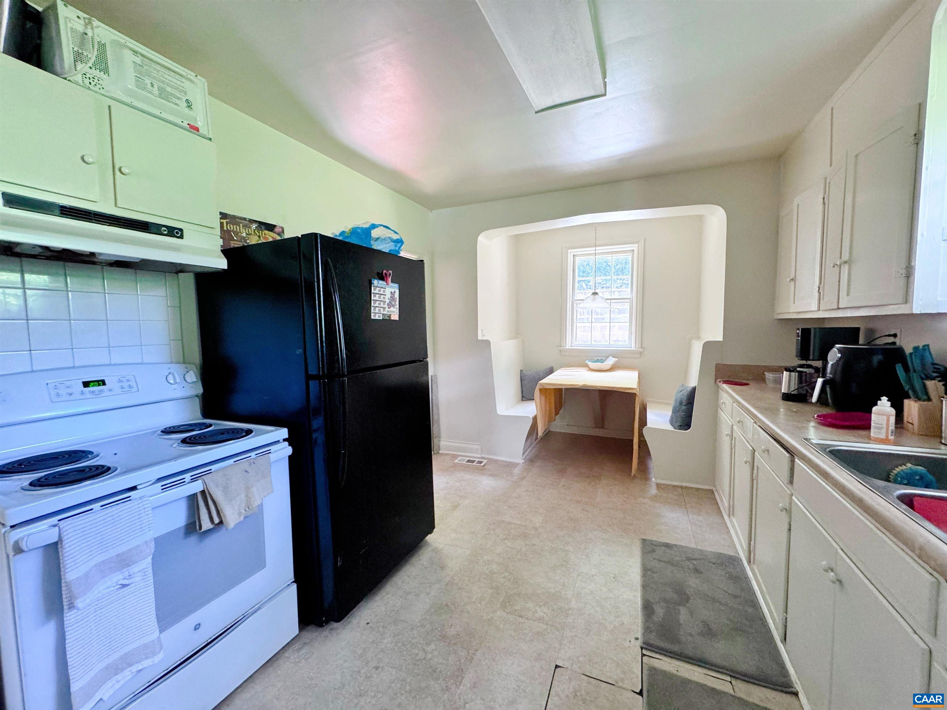505 Valley Road Charlottesville, VA 22903 - Photo 19 of 29 a kitchen with a refrigerator and a stove