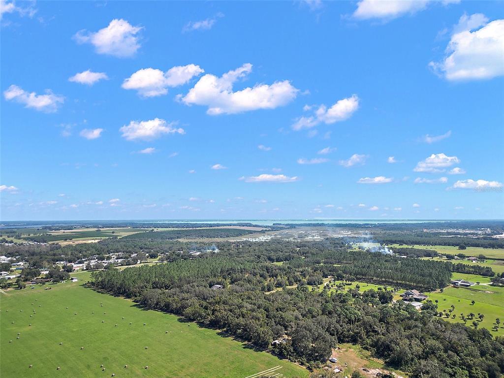 11001 Moon Crest Lane Leesburg, FL 34788 - Photo 17 of 25 a view of a city with lots of trees