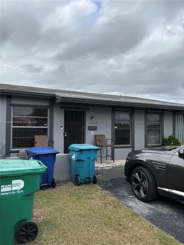 a car parked in front of a house