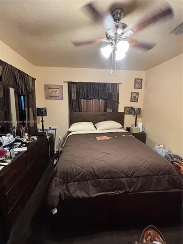 a bathroom with a sink toilet and window