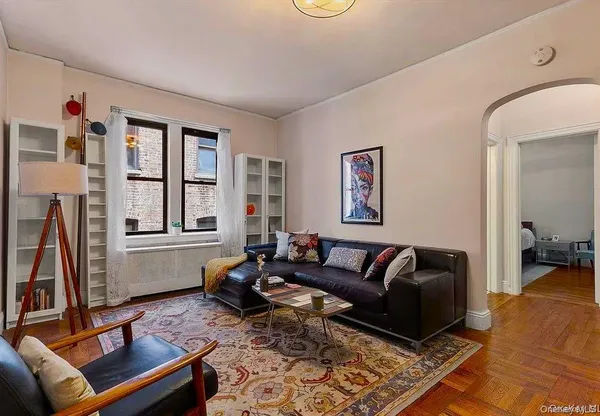 a living room with furniture or couch and a flat screen tv