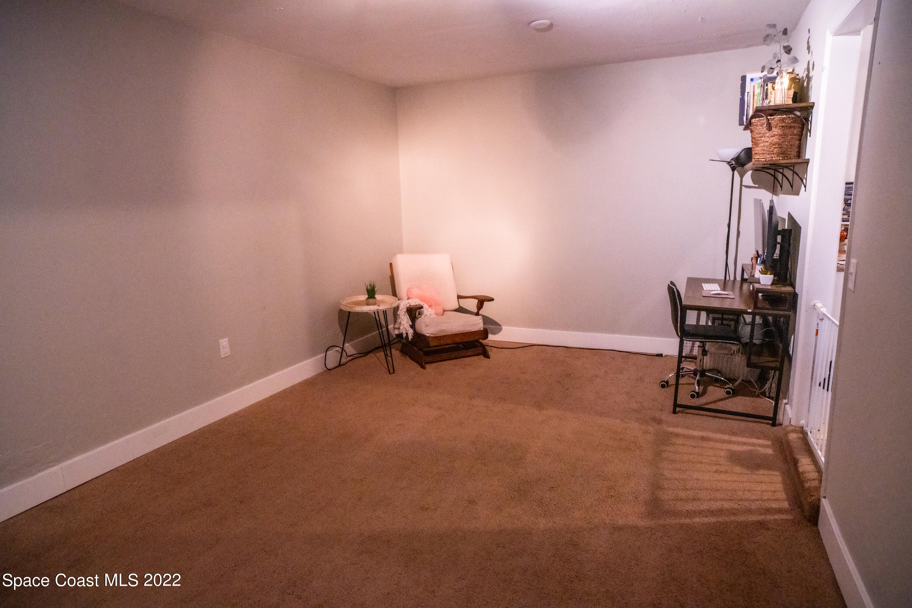 235 Capron Road Cocoa, FL 32927 - Photo 13 of 19 a room with furniture and a wooden floor