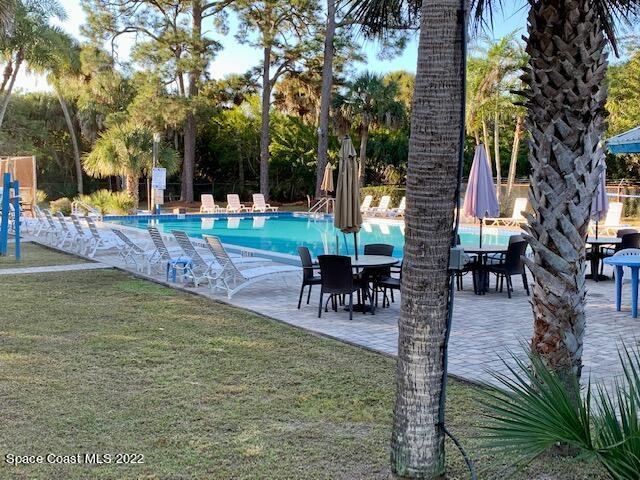 235 Capron Road Cocoa, FL 32927 - Photo 18 of 19 a swimming pool with outdoor seating and yard