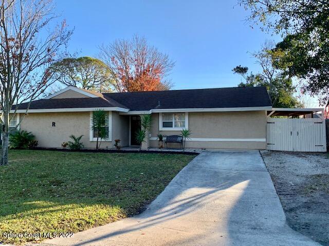 235 Capron Road Cocoa, FL 32927 - Photo 2 of 19 a front view of a house with garden