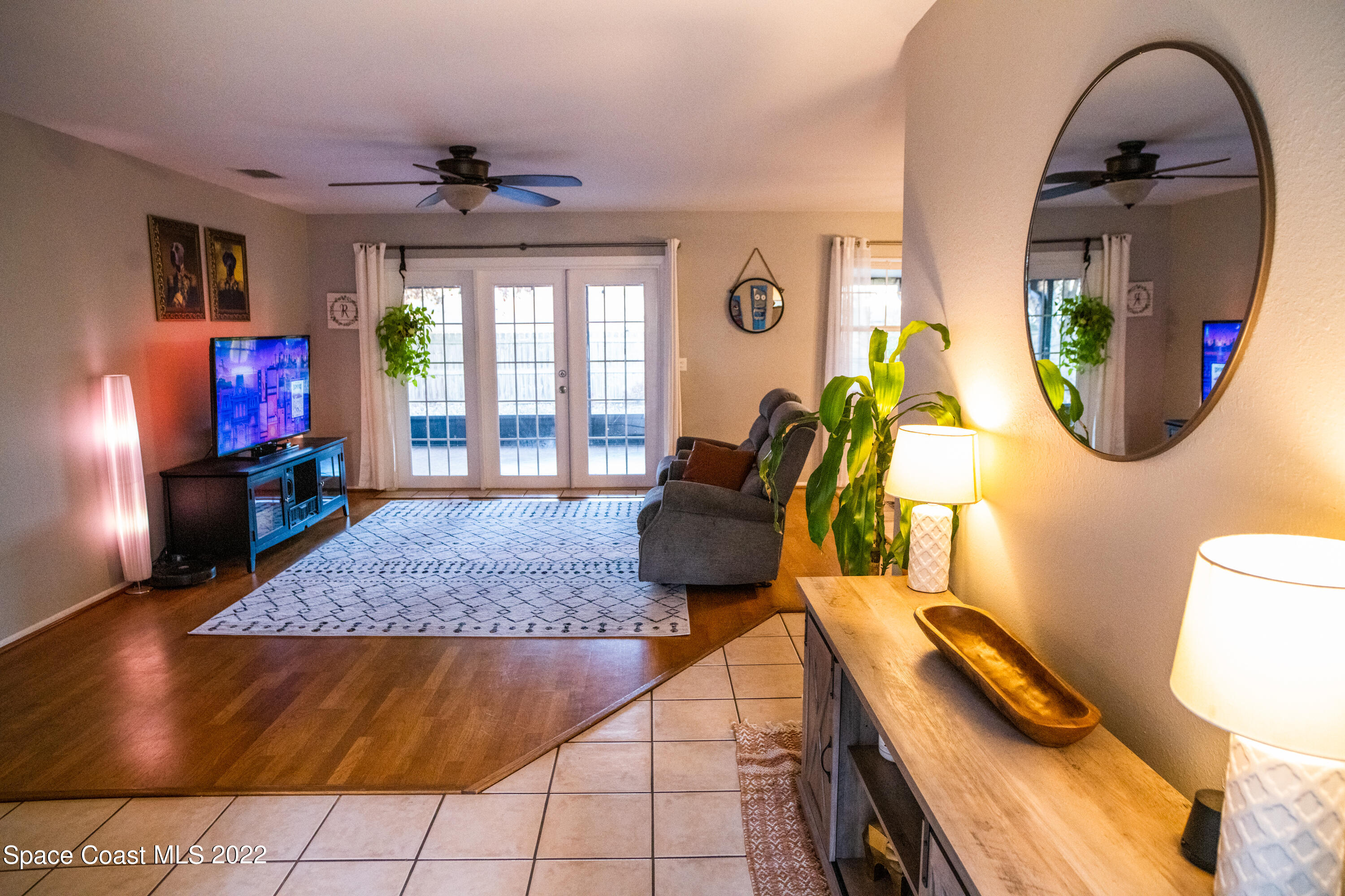 235 Capron Road Cocoa, FL 32927 - Photo 4 of 19 a living room with furniture and a wooden floor