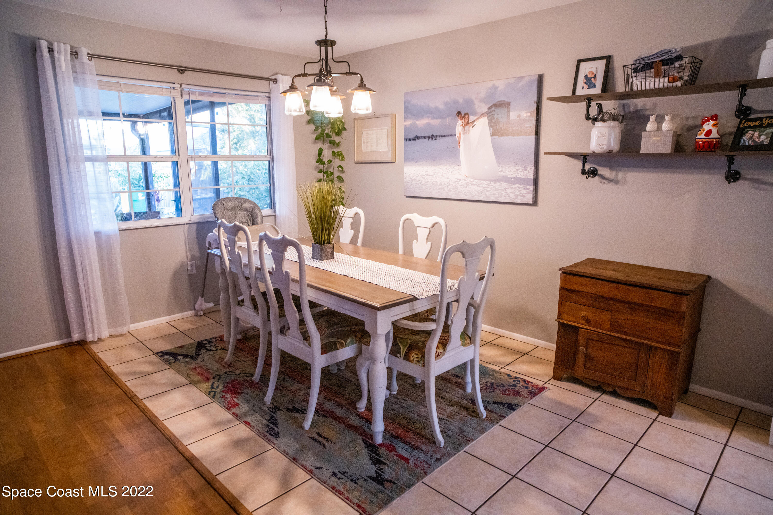 235 Capron Road Cocoa, FL 32927 - Photo 6 of 19 a view of a dining room with furniture and chandelier