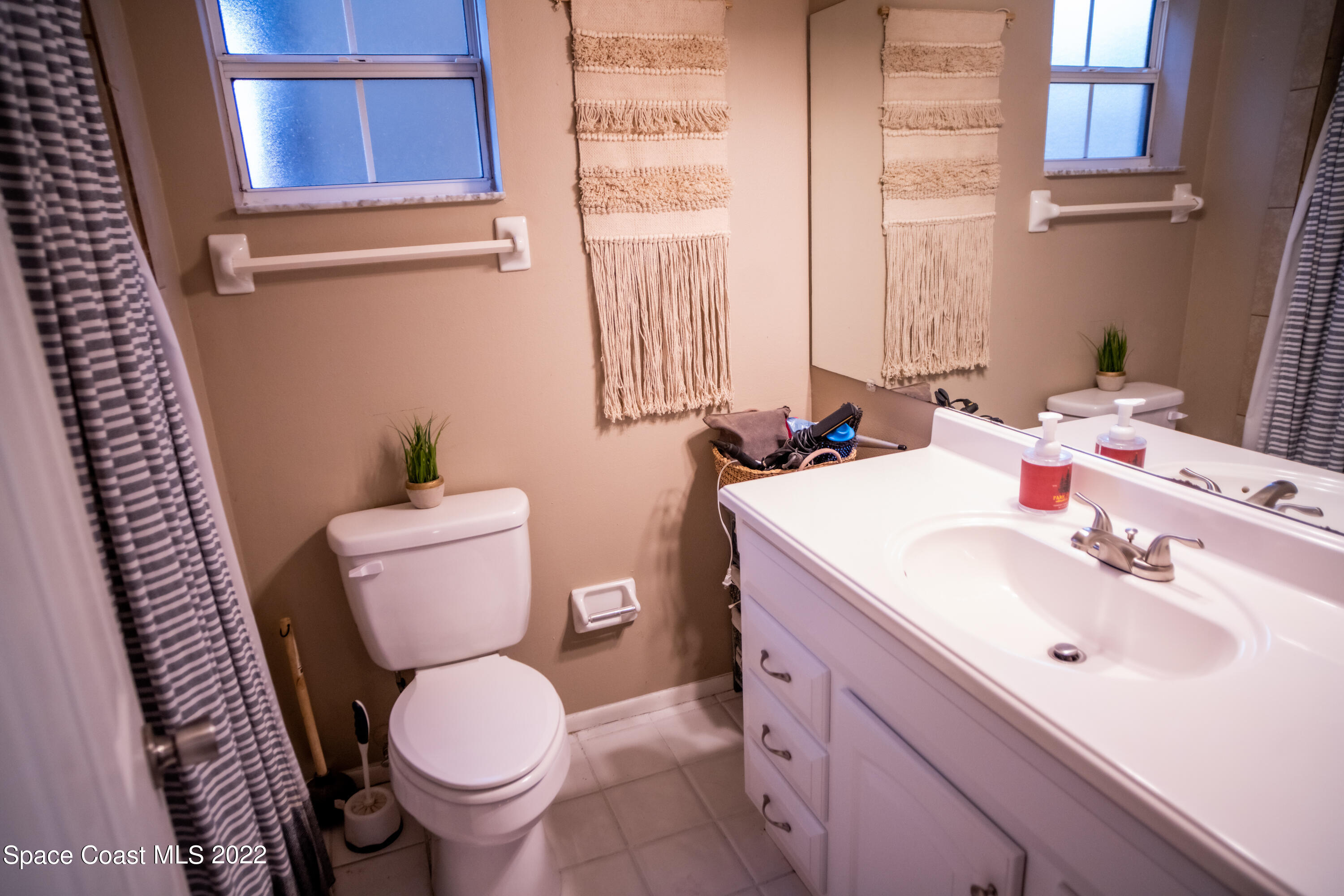 235 Capron Road Cocoa, FL 32927 - Photo 10 of 19 a bathroom with a sink and a toilet
