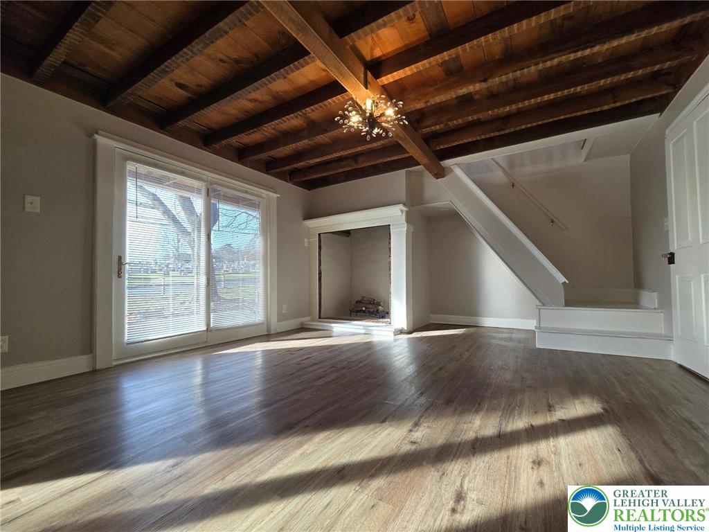 505 Penn Street Bath, PA 18014 - Photo 2 of 18 a view of an empty room with wooden floor and a window