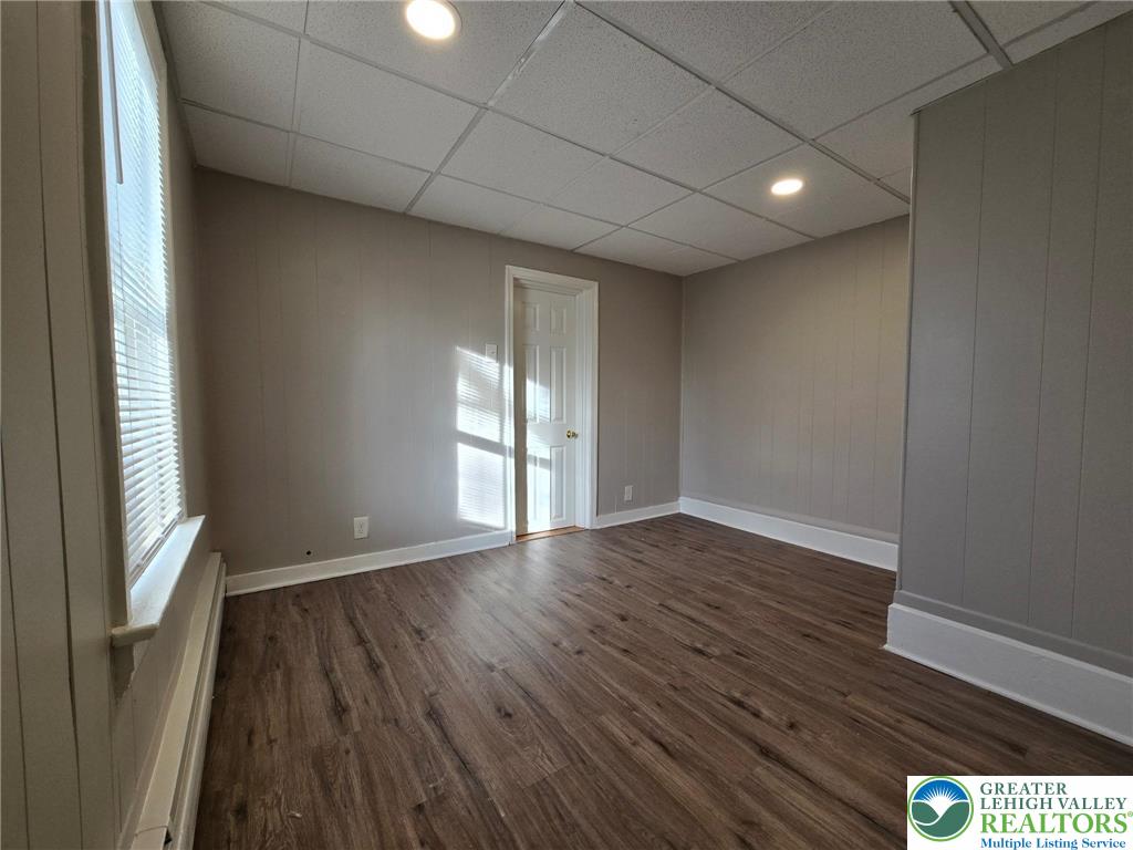 505 Penn Street Bath, PA 18014 - Photo 5 of 18 a view of an empty room with wooden floor and a window