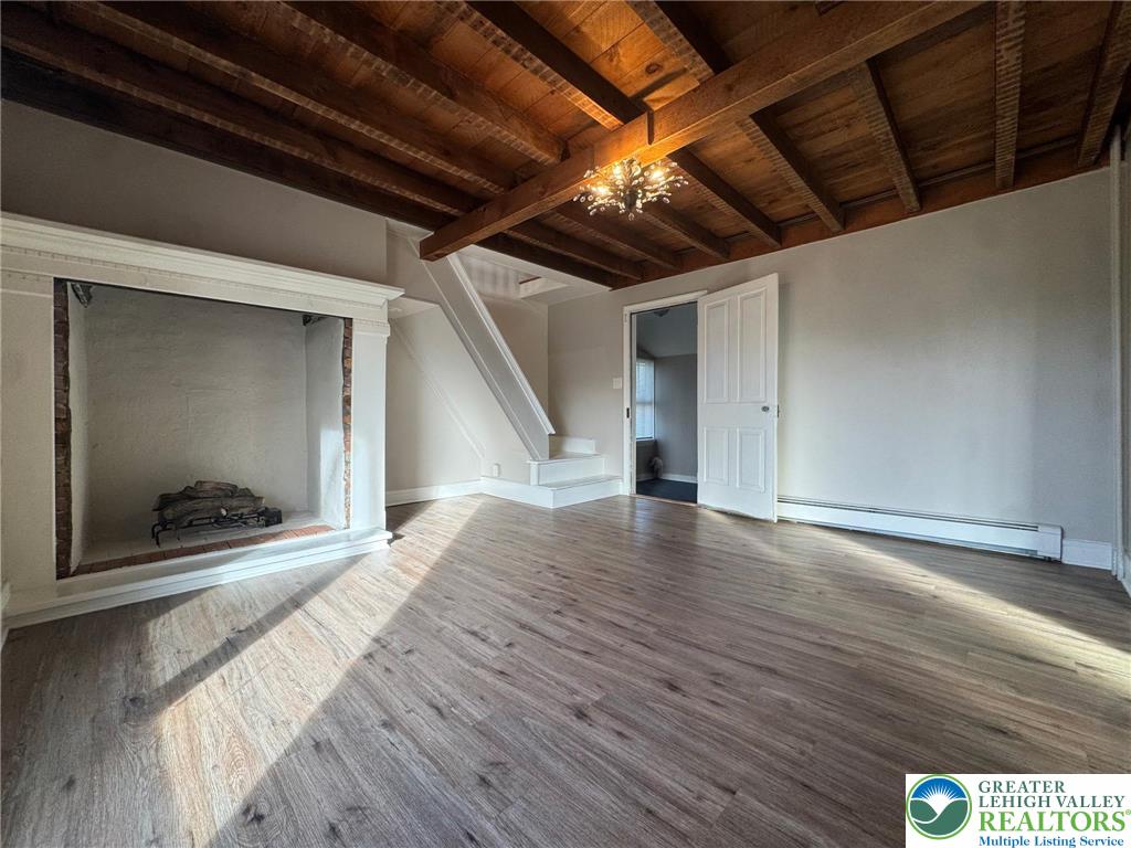 505 Penn Street Bath, PA 18014 - Photo 10 of 18 a view of an empty room with wooden floor and a ceiling fan