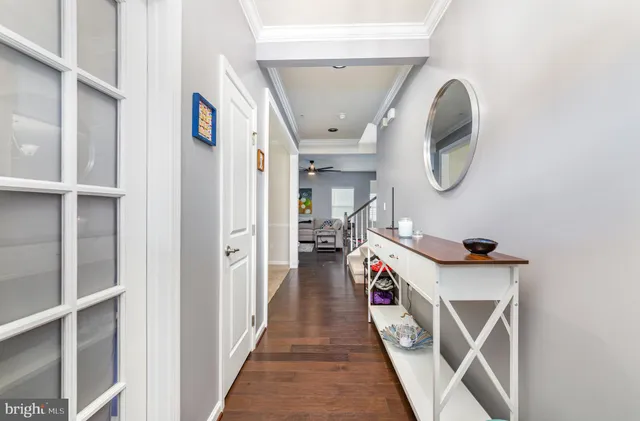 a view of a dining room with furniture and a chandelier