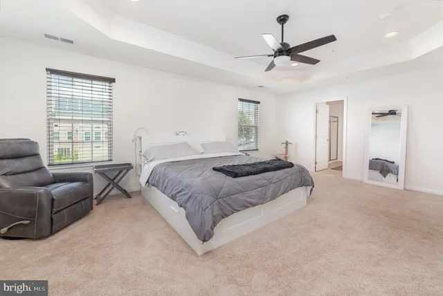 a white toilet sitting next to a shower