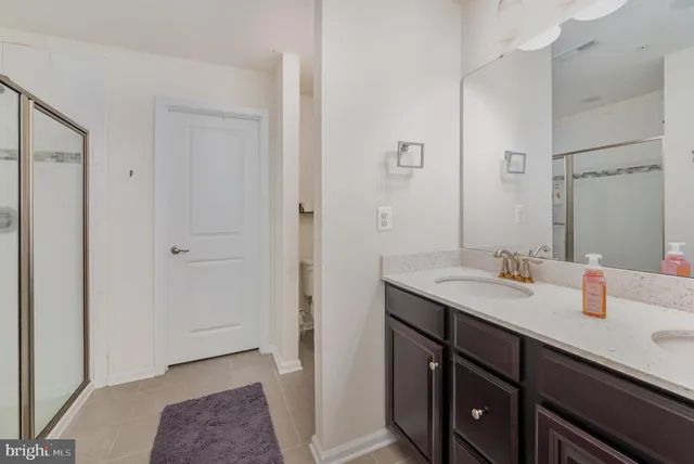 a bedroom with a bed and a dresser in it