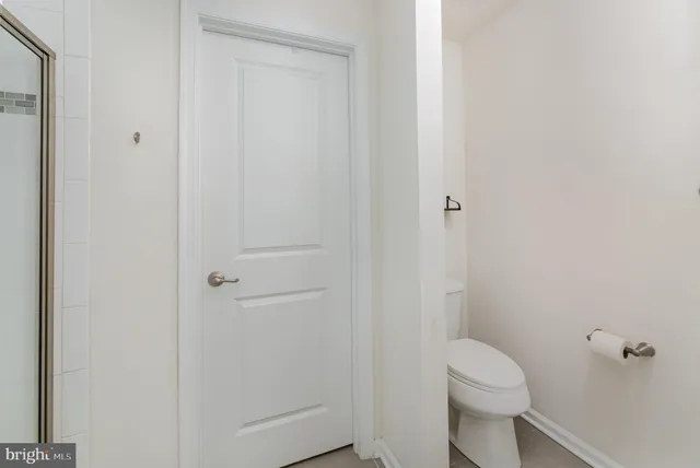 a bedroom with a bed and a furniture in it