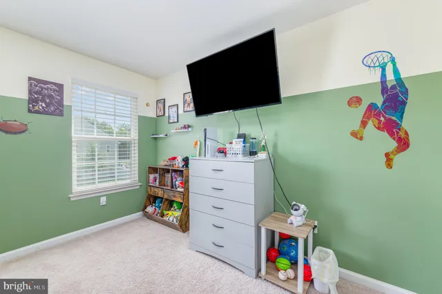 a bathroom with a sink a toilet a mirror and shower curtain