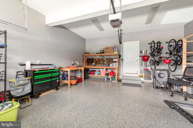 a view of a garage with parked cars