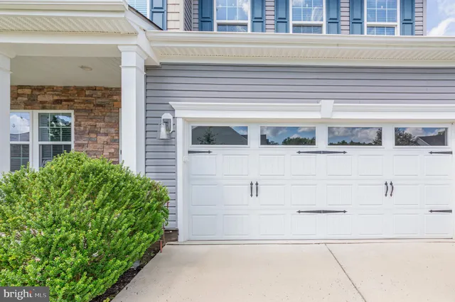 a front view of a building with white walls