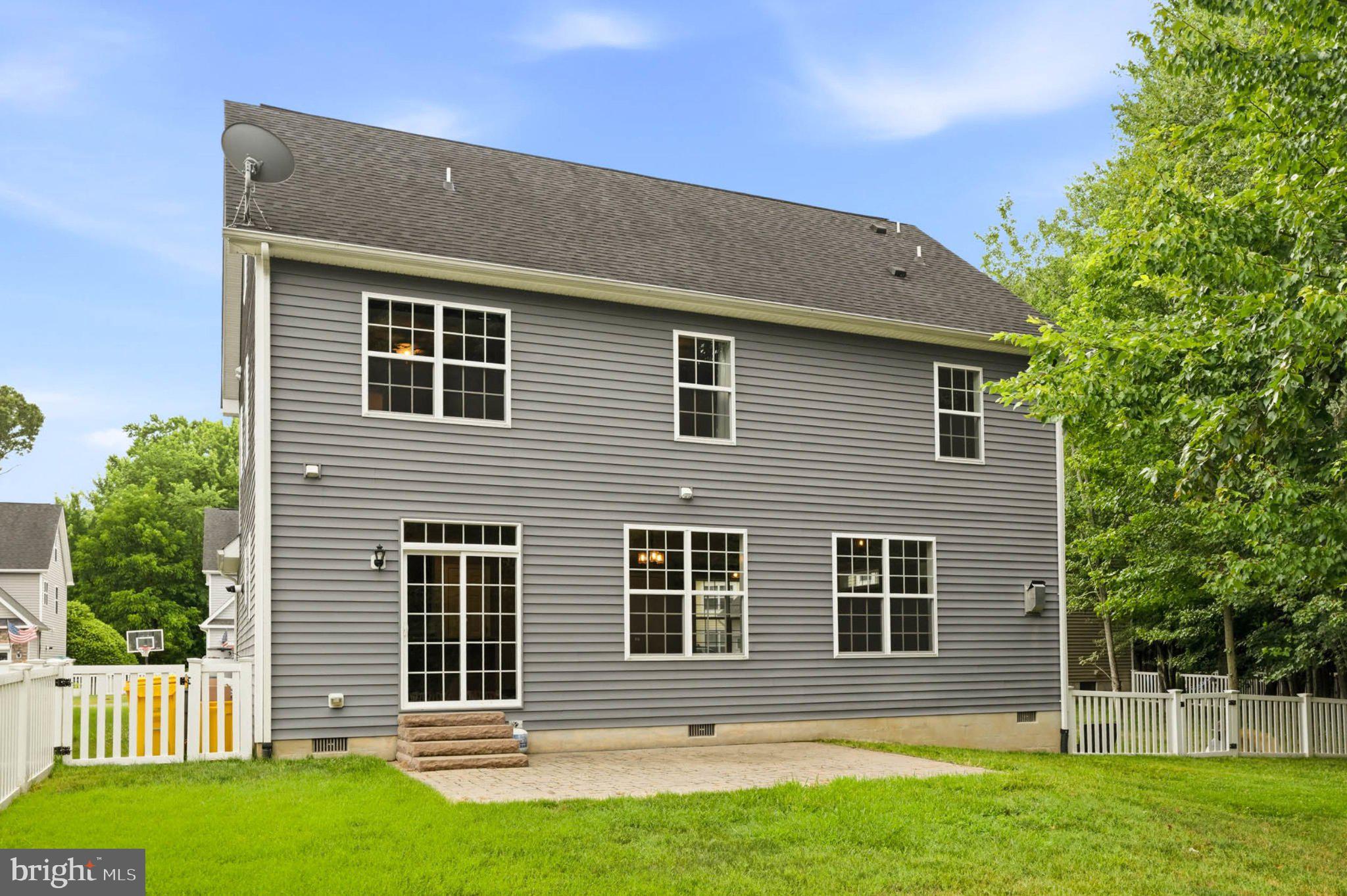 706 Trapper Way Deale, MD 20751 - Photo 46 of 61 Charming gray home with lush greenery.