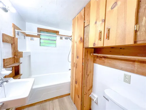 a bathroom with a bathtub and a sink