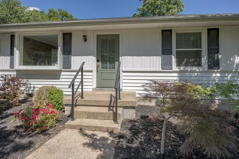 a view of house with outdoor space