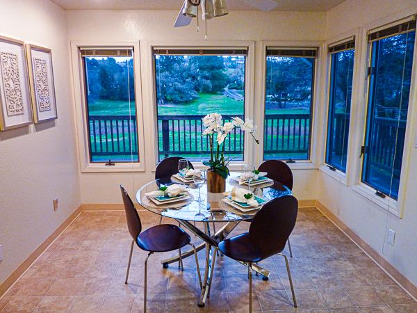 17080 Copper Hill Drive Morgan Hill, CA 95037 - Photo 18 of 38 a view of a dining room with furniture large windows and wooden floor