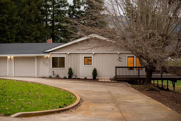 17080 Copper Hill Drive Morgan Hill, CA 95037 - Photo 3 of 38 a view of a house with backyard sitting area and trees
