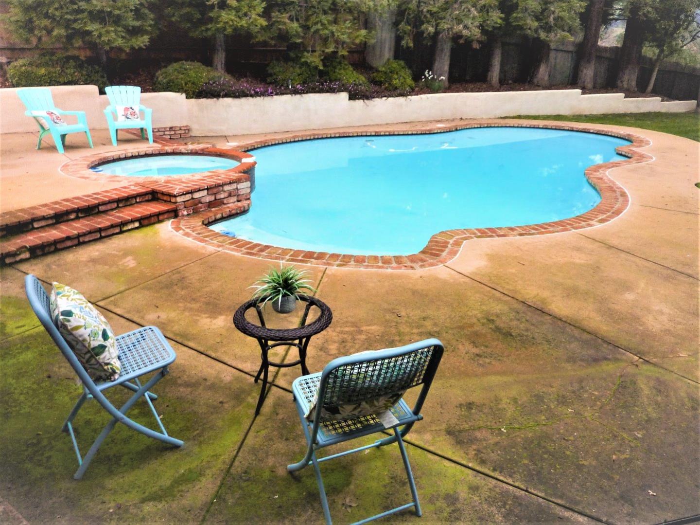 17080 Copper Hill Drive Morgan Hill, CA 95037 - Photo 36 of 38 a view of a swimming pool with lounge chair