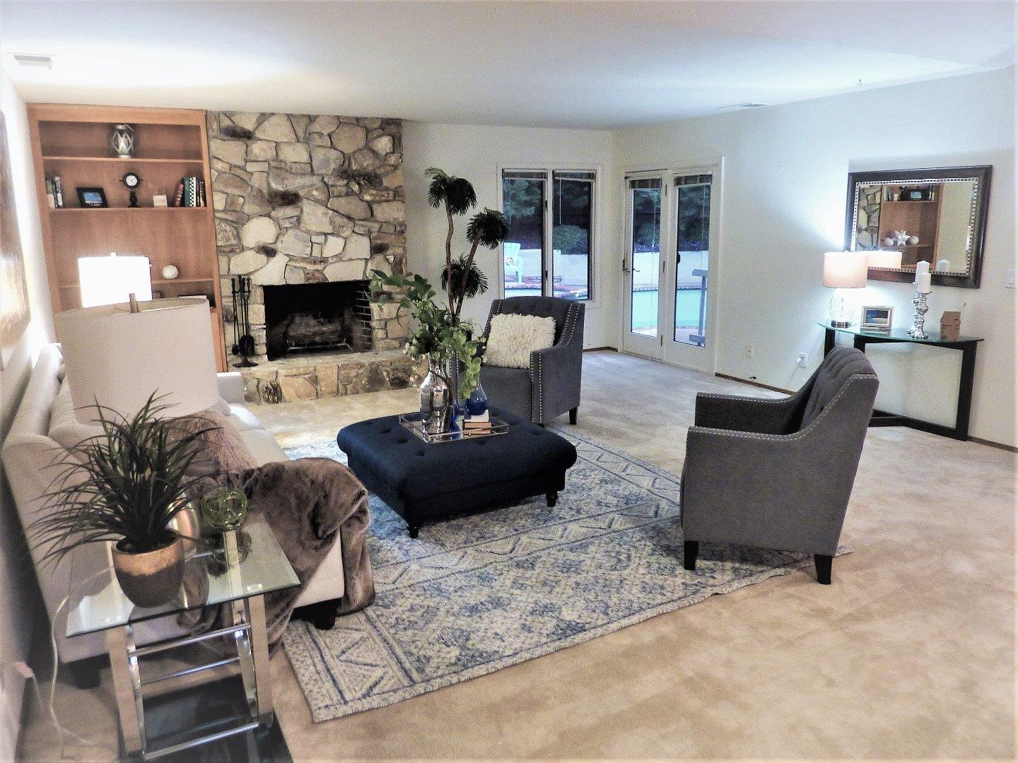 17080 Copper Hill Drive Morgan Hill, CA 95037 - Photo 8 of 38 a living room with furniture potted plant and a fireplace