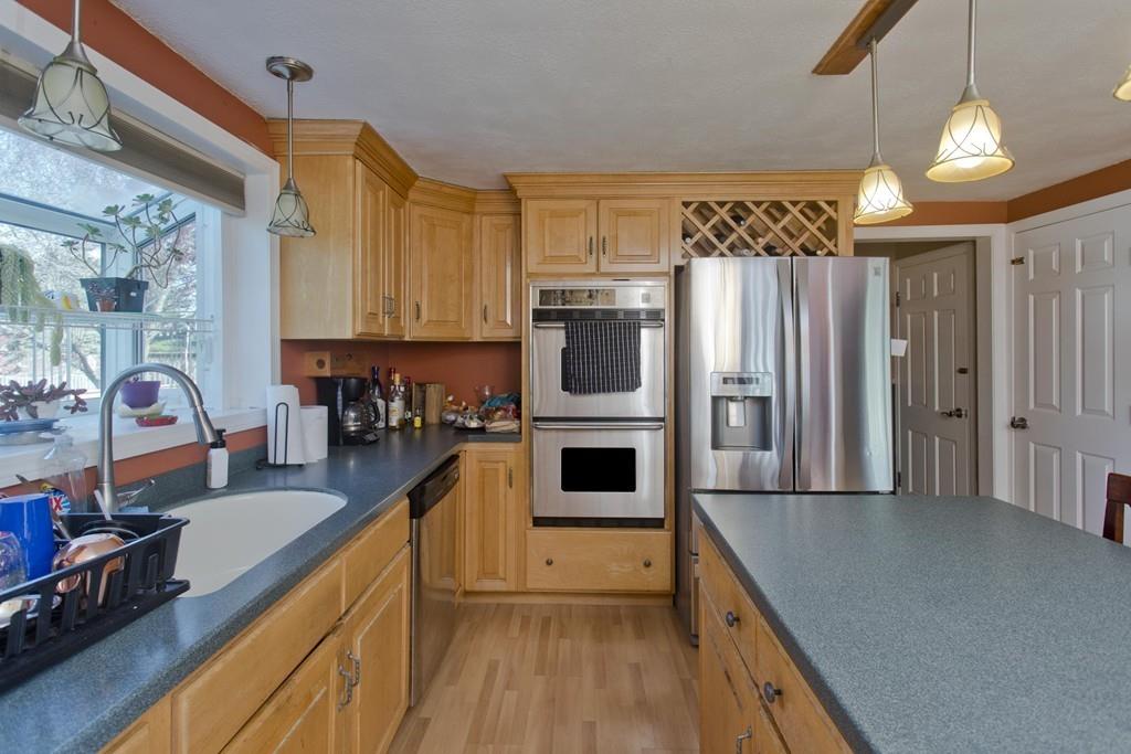 38 Pine Acre Road Springfield, MA 01129 - Photo 11 of 40 a kitchen with cabinets and stainless steel appliances